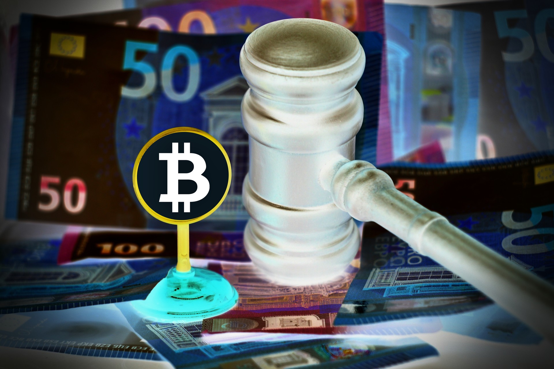 Auction gavel and bitcoin cryptocurrency money on a wooden desk, close-up. Law Gavel and golden bitcoin symbol on white background with copyspace